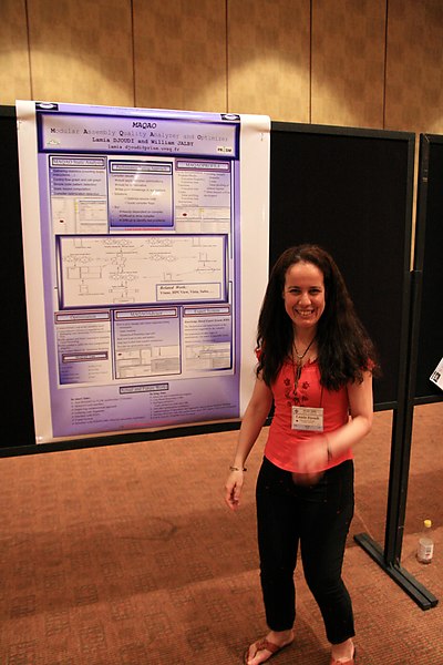 Lamia enthusiastically presenting her poster